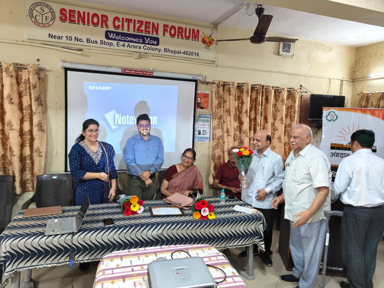 Blood pressure consultation at senior citizen health camp